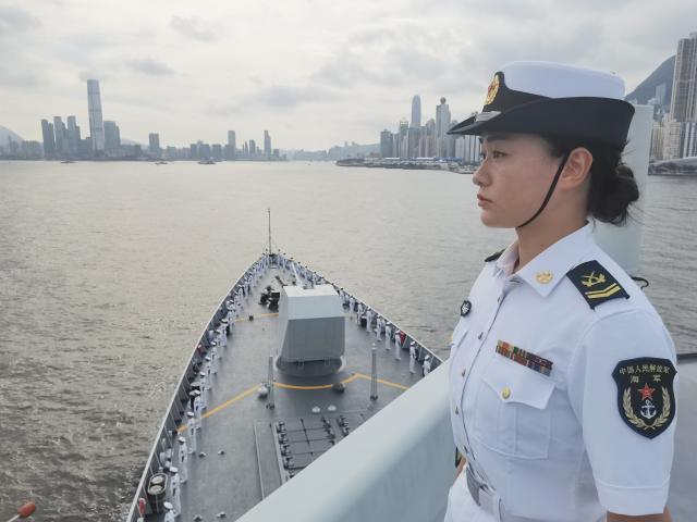 (250703) -- HONG KONG, July 3, 2025 (Xinhua) -- Soldiers line up on the deck of Zhanjiang missile destroyer during its visit to Hong Kong, south China, on July 3, 2025. A fleet of the Chinese People's Liberation Army Navy led by the aircraft carrier Shandong arrived here on Thursday morning. (Photo by Li Tang/Xinhua)