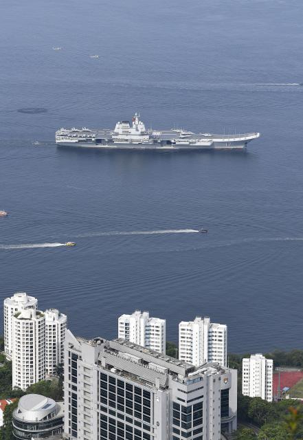 (250703) -- HONG KONG, July 3, 2025 (Xinhua) -- This photo shows the aircraft carrier Shandong sailing in Hong Kong waters, south China, July 3, 2025. A fleet of the Chinese People's Liberation Army (PLA) Navy led by the aircraft carrier Shandong arrived in the Hong Kong Special Administrative Region (HKSAR) on Thursday morning, kicking off a five-day visit.
   The aircraft carrier and the Yan'an missile destroyer were anchored near the west end of the Victoria Harbor, while the Zhanjiang missile destroyer and the Yuncheng missile frigate docked at the PLA Hong Kong Garrison's naval base in Stonecutters Island.
   This is the Shandong's first visit to Hong Kong. From Friday to Sunday, the Shandong, the Zhanjiang and the Yuncheng will host open tours, lectures, drill demonstrations and other exchange activities. (Xinhua/Chen Duo)