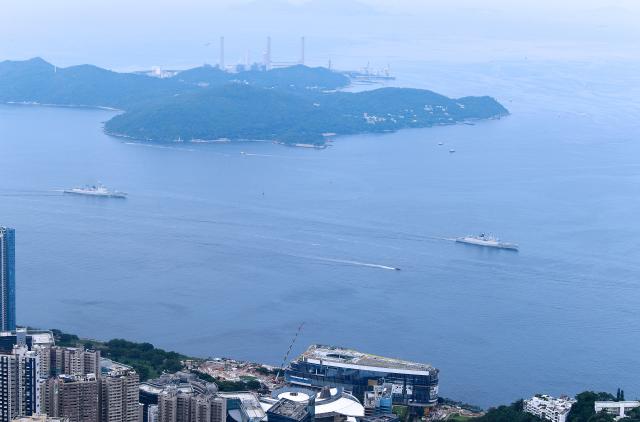 (250703) -- HONG KONG, July 3, 2025 (Xinhua) -- This photo shows the Yuncheng missile frigate (R) and the Zhanjiang missile destroyer sailing in Hong Kong waters, south China, July 3, 2025. A fleet of the Chinese People's Liberation Army (PLA) Navy led by the aircraft carrier Shandong arrived in the Hong Kong Special Administrative Region (HKSAR) on Thursday morning, kicking off a five-day visit.
   The aircraft carrier and the Yan'an missile destroyer were anchored near the west end of the Victoria Harbor, while the Zhanjiang missile destroyer and the Yuncheng missile frigate docked at the PLA Hong Kong Garrison's naval base in Stonecutters Island.
   This is the Shandong's first visit to Hong Kong. From Friday to Sunday, the Shandong, the Zhanjiang and the Yuncheng will host open tours, lectures, drill demonstrations and other exchange activities. (Xinhua/Chen Duo)