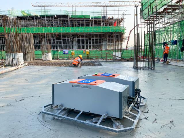 (250703) -- CHONGQING, July 3, 2025 (Xinhua) -- This photo taken on April 27, 2023 shows a four-head screed robot working at the construction site of Chongqing East Railway Station in southwest China's Chongqing. As the new section of the Chongqing-Xiamen high-speed railway, from Chongqing to Qianjiang, officially opened a week ago, the key hub along this route, Chongqing East Railway Station, was also put into operation.
   From obtaining the design blueprints in May 2022 to its official inauguration, it has taken 38 months to complete what is now the largest high-speed rail station in west China. Behind this monumental construction project are a group of unsung heroes -- robots.
   TO GO WITH "China Focus: A robot revolution in building the largest railway station in west China" (China Railway Construction Engineering Group/Handout via Xinhua)