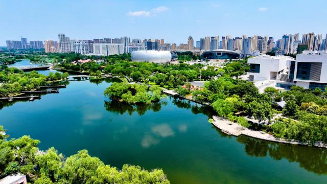 (250703) -- HEZE, July 3, 2025 (Xinhua) -- An aerial drone photo taken on June 21, 2025 shows a view of Zhaowanghe wetland park in Heze City, east China's Shandong Province. The Yellow River, which flows through Heze, not only shapes the hallmark of the city in central China, but also nurtures the peonies with beauty and fragrance, creating a flower city with water charm.
  As the "peony capital of China", the peony planting in Heze can be traced back to the Sui and Tang dynasties (581-907). At present, the city has bred 1,308 varieties of peonies. (Xinhua/Guo Xulei)