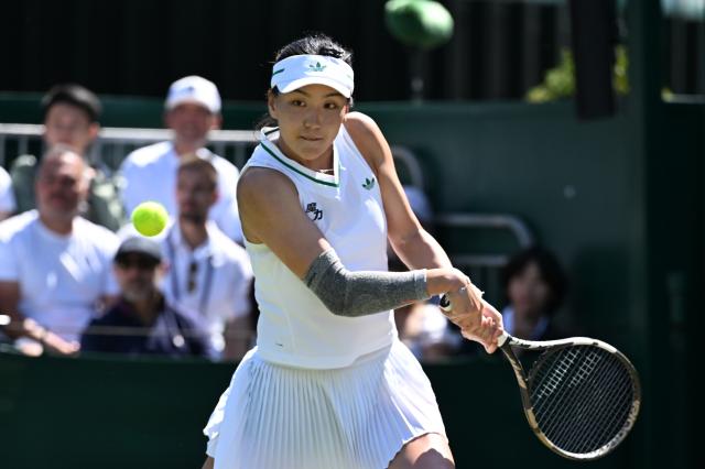(250703) -- LONDON, July 3, 2025 (Xinhua) -- Wang Xinyu hits a return during the women's singles second round match between Wang Xinyu of China and Zeynep Sonmez of Türkiye at the Wimbledon Tennis Championships in London, Britain, July 3, 2025. (Xinhua/Zhao Dingzhe)