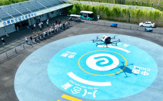 (250703) -- HEFEI, July 3, 2025 (Xinhua) -- A drone photo taken on July 2, 2025 shows an electric vertical take-off-and-landing (eVTOL) aircraft performing flight demonstration at Luogang Park in Hefei, east China's Anhui Province. In alignment with the national strategy to cultivate industries of the future, Hefei is forging ahead with strategic layouts in emerging frontiers like quantum information, low-altitude economy, commercial aerospace, fusion energy, artificial intelligence, intelligent robotics, and biosynthetic manufacturing to accelerate industrial cluster formation. The city has achieved remarkable progress across multiple future industry sectors, emerging as a robust hub of rapid advancement. (Xinhua/Zhou Mu)