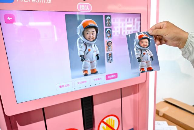 (250703) -- HEFEI, July 3, 2025 (Xinhua) -- A visitor experiences an AI image generation function of HiDream.ai, a high-tech startup focusing on generative intelligence for creativity, in Hefei, east China's Anhui Province, July 2, 2025. In alignment with the national strategy to cultivate industries of the future, Hefei is forging ahead with strategic layouts in emerging frontiers like quantum information, low-altitude economy, commercial aerospace, fusion energy, artificial intelligence, intelligent robotics, and biosynthetic manufacturing to accelerate industrial cluster formation. The city has achieved remarkable progress across multiple future industry sectors, emerging as a robust hub of rapid advancement. (Xinhua/Zhang Cheng)