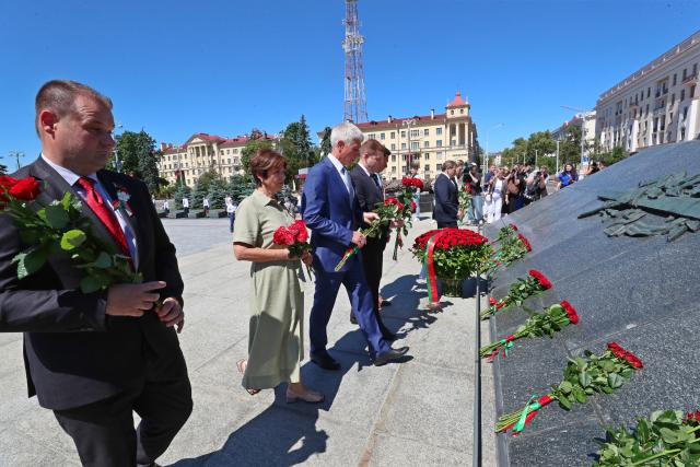 (250704) -- MINSK, July 4, 2025 (Xinhua) -- People pay tribute to the monument in Victory Square to mark Belarus Independence Day in Minsk, Belarus, on July 3, 2025. Belarus celebrated its most important national holiday on Thursday, commemorating a significant historical moment of liberation during World War II. (Photo by Henadz Zhinkov/Xinhua)