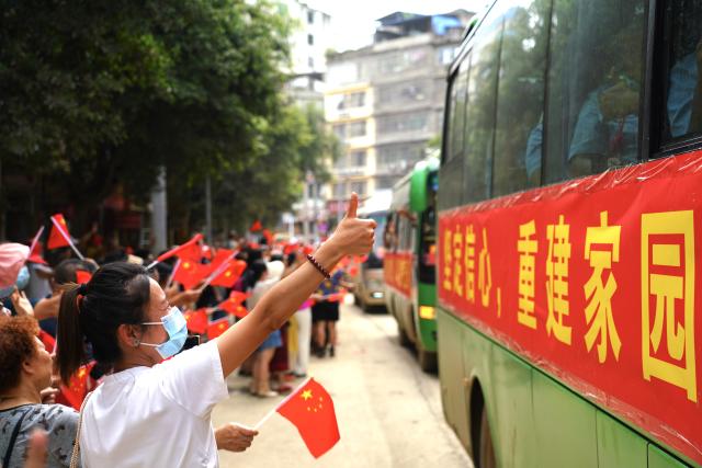 (250704) -- BEIJING, July 4, 2025 (Xinhua) -- A local gives a thumb-up to rescuers as they leave after the mission was accomplished, in Rongjiang County, southwest China's Guizhou Province, July 3, 2025. The flood control and rescue teams from various places that had rushed to Rongjiang County began to leave in an orderly manner on Thursday. Local residents spontaneously took to the streets to bid farewell to the rescue teams and express their gratitude.
   Rongjiang County in southwest China's Guizhou Province, widely known as the birthplace of the Village Super League, or Cun Chao, is beginning post-disaster recovery after being hit by two severe floods in less than a week. As floodwaters receded, (Photo by Yang Wukui/Xinhua)