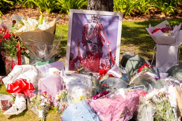 (250704) -- BEIJING, July 4, 2025 (Xinhua) -- Flowers and tributes to Diogo Jota are left outside Anfield Stadium in Liverpool, Britain, July 3, 2025. Liverpool's Portuguese international forward Diogo Jota and his brother Andre died in the early hours of Thursday morning in a car accident in north-east Spain, according to Spanish authorities. (Xinhua)