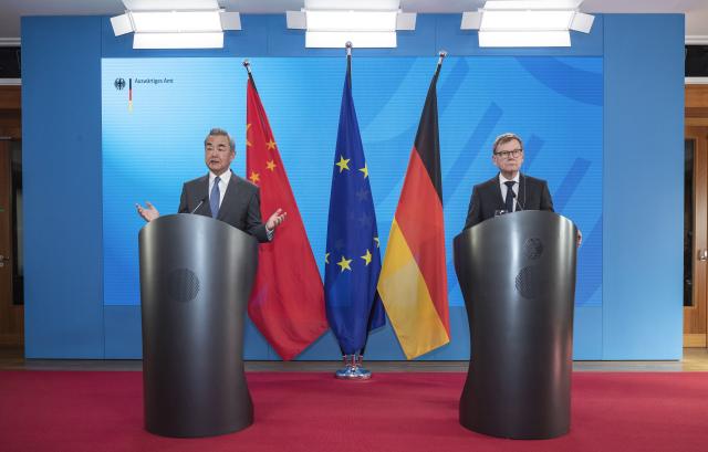 (250704) -- BERLIN, July 4, 2025 (Xinhua) -- Chinese Foreign Minister Wang Yi, also a member of the Political Bureau of the Communist Party of China Central Committee, and German Foreign Minister Johann Wadephul jointly meet the press in Berlin, Germany, July 3, 2025. (Xinhua/Zhang Fan)