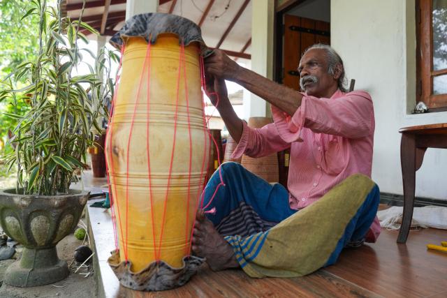 (250704) -- KADUGANNAWA, July 4, 2025 (Xinhua) -- A man assembles a traditional drum in Kadugannawa, Sri Lanka, July 3, 2025. The central region of Sri Lanka, especially Kadugannawa, is famous for the making and use of traditional wooden drums, which play an important role in Sri Lankan rituals and dances. (Photo by Thilina Kaluthotage/Xinhua)