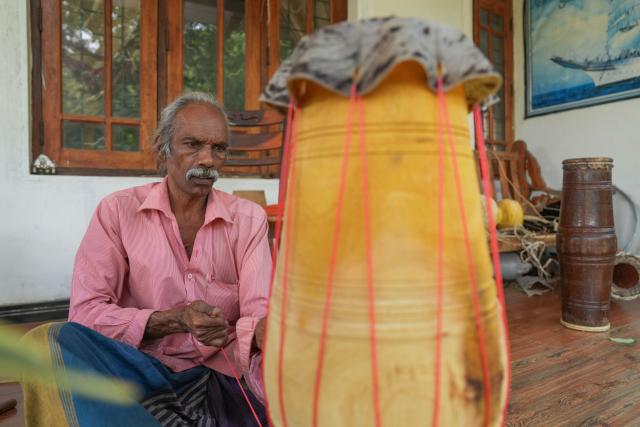 (250704) -- KADUGANNAWA, July 4, 2025 (Xinhua) -- A man assembles a traditional drum in Kadugannawa, Sri Lanka, July 3, 2025. The central region of Sri Lanka, especially Kadugannawa, is famous for the making and use of traditional wooden drums, which play an important role in Sri Lankan rituals and dances. (Photo by Thilina Kaluthotage/Xinhua)
