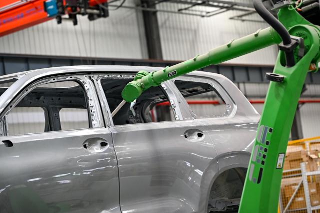 (250704) -- WUHU, July 4, 2025 (Xinhua) -- This photo taken on July 3, 2025 shows a spray-painting robot at Anhui Efort Intelligent Equipment Co., Ltd. in Wuhu, east China's Anhui Province.
  Founded in 2007, Anhui Efort Intelligent Equipment Co., Ltd. produces robots widely used in industries such as electronics, photovoltaics, lithium batteries, automotive and auto parts, rail transit, and shipbuilding. 
   The company established a comprehensive R&D system for core technologies, having achieved a 100% ratio in localization and self-sufficiency for critical components. It sold over 16,000 industrial robots in 2024.
   As the first national-level robotics industry cluster in the country, Wuhu is home to more than 300 enterprises along the robotics supply chain. The city's robotics industry output exceeded 40 billion yuan (about 5.58 billion U.S. dollars) in 2024. (Xinhua/Zhang Cheng)
