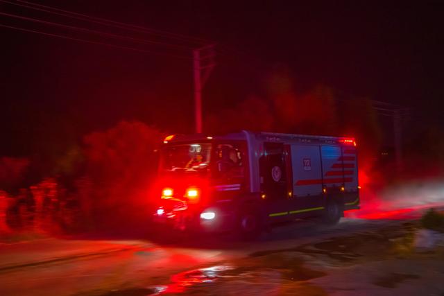 (250704) -- IZMIR, July 4, 2025 (Xinhua) -- A fire truck is seen near a wildfire in the Odemis district of Izmir, Türkiye. Izmir Governor Suleyman Elban said on Thursday that the wildfire erupted on Wednesday afternoon in the Cesme district, a popular coastal tourist destination. The blaze has been taken under control, but the inland district of Odemis remains uncontrolled, he added.
According to Elban, the fires were caused by faults in electricity distribution lines and there are no signs of sabotage. (Mustafa Kaya/Handout via Xinhua)
