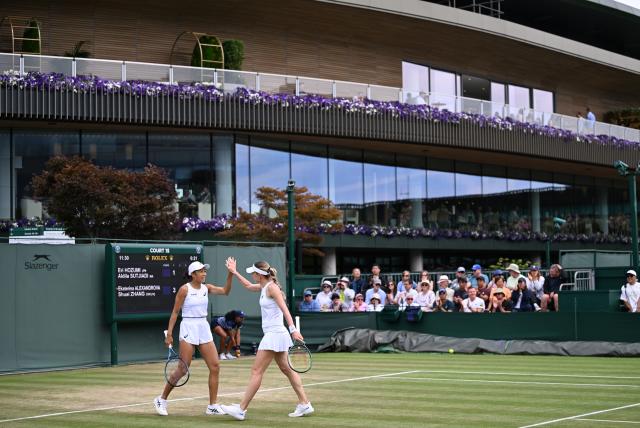 (250704) -- LONDON, July 4, 2025 (Xinhua) -- Zhang Shuai (L)/Ekaterina Alexandrova celebrate during the women's doubles second round match between Zhang Shuai (China)/Ekaterina Alexandrova (Russia) and Hozumi Eri (Japan)/Aldila Sutjiadi (Indonesia) at the Wimbledon Tennis Championships in London, Britain, July 4, 2025. (Xinhua/Li Ying)