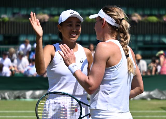 (250704) -- LONDON, July 4, 2025 (Xinhua) -- Zhang Shuai (L) celebrates with Ekaterina Alexandrova after the women's doubles second round match between Zhang Shuai (China)/Ekaterina Alexandrova (Russia) and Hozumi Eri (Japan)/Aldila Sutjiadi (Indonesia) at the Wimbledon Tennis Championships in London, Britain, July 4, 2025. (Xinhua/Li Ying)