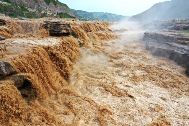 (250704) -- JIXIAN, July 4, 2025 (Xinhua) -- A drone photo taken in Jixian County of north China's Shanxi Province on July 4, 2025 shows the scenery of the Hukou Waterfall on the Yellow River. (Photo by Lyu Guiming/Xinhua)