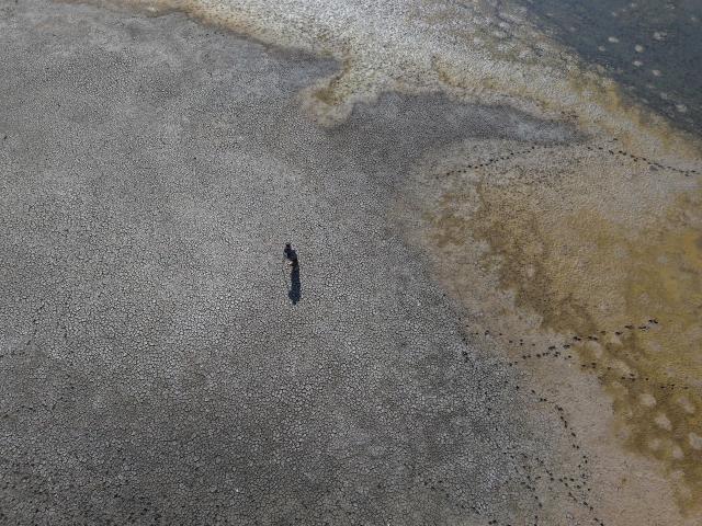 (250704) -- ANKARA, July 4, 2025 (Xinhua) -- An aerial drone photo taken on July 2, 2025 shows the drought-stricken Kurtbogazi Dam in Ankara, Türkiye. As summer grips Türkiye's capital, Ankara, the city of nearly 6 million is confronting a worsening water crisis. Reservoirs are nearing historic lows, and drought conditions exacerbated by climate change threaten to deliver one of central Anatolia's weakest wheat harvests in years. (Mustafa Kaya/Handout via Xinhua) TO GO WITH Feature: Water crisis strains urban water, slashes crops in Turkish capital