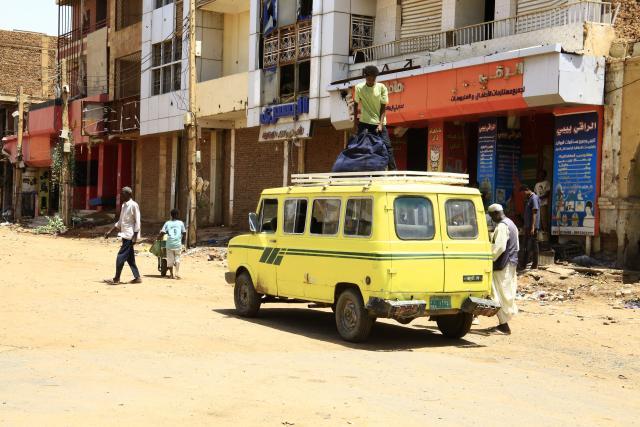 (250704) -- OMDURMAN (SUDAN), July 4, 2025 (Xinhua) -- A vehicle is seen near a store in Omdurman city, north of Khartoum, Sudan, on July 3, 2025. After more than two years of devastating conflict, Sudan's capital Khartoum is slowly emerging from the ruins of war, inching toward a return to normal life. (Photo by Mohamed Khidir/Xinhua) TO GO WITH Feature: Sudan's Khartoum strives to recover amid ongoing civil war