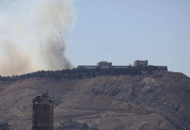 (250705) -- DAMASCUS, July 5, 2025 (Xinhua) -- Smoke rises as a result of a fire that erupted near the Syrian al-Shaab presidential palace in Damascus, Syria, July 4, 2025. Unknown fire erupted Friday afternoon in bushes close to the Syrian al-Shaab presidential palace situated on top of a mountain overlooking the capital Damascus, sending thick plums of black smoke over wide areas, local media and witnesses said. (Photo by Ammar Safarjalani/Xinhua)