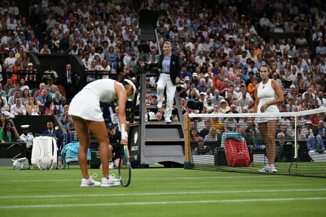 (250705) -- LONDON, July 5, 2025 (Xinhua) -- Aryna Sabalenka (R) of Belarus checks on Emma Raducanu (L) of Britain after an injury during their women's singles third round match at the Wimbledon Tennis Championships in London, Britain, July 4, 2025. (Xinhua/Zhao Dingzhe)