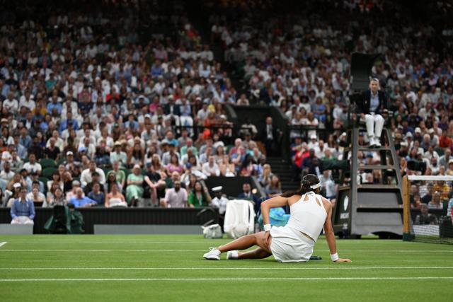 (250705) -- LONDON, July 5, 2025 (Xinhua) -- Emma Raducanu falls down during the women's singles third round match between Aryna Sabalenka of Belarus and Emma Raducanu of Britain at the Wimbledon Tennis Championships in London, Britain, July 4, 2025. (Xinhua/Zhao Dingzhe)