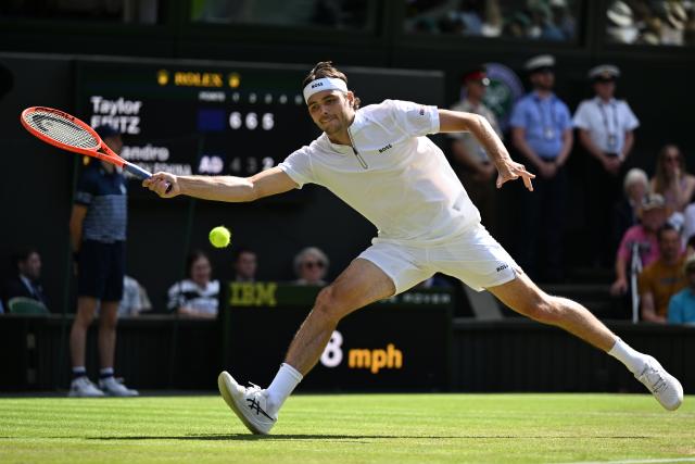 (250705) -- LONDON, July 5, 2025 (Xinhua) -- Taylor Fritz hits a return during the men's singles third round match between Taylor Fritz of the United States and Alejandro Davidovich Fokina of Spain at the Wimbledon Tennis Championships in London, Britain, July 4, 2025. (Xinhua/Zhao Dingzhe)