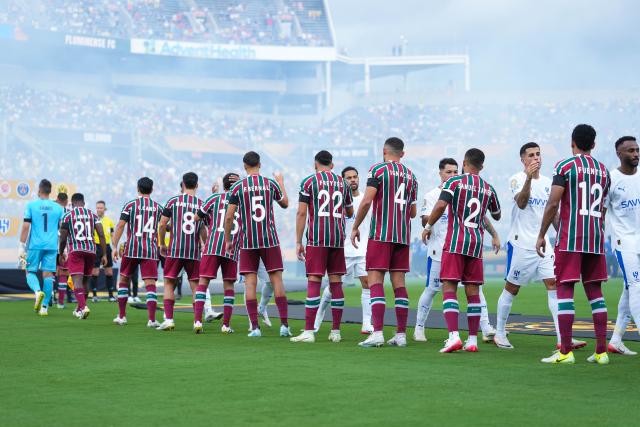 (250705) -- ORLANDO, July 5, 2025 (Xinhua) -- Players of both teams greet each other before the quarterfinal match between Fluminense FC of Brazil and Al Hilal of Saudi Arabia at the FIFA Club World Cup 2025 at the Camping World Stadium, Orlando, Florida, the United States, July 4 , 2025. (Xinhua/Xu Chang)