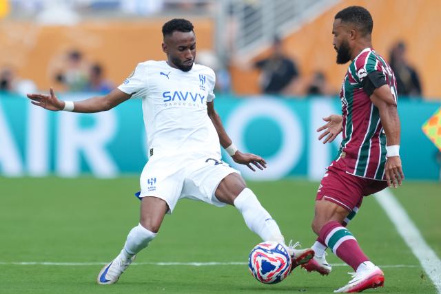 (250705) -- ORLANDO, July 5, 2025 (Xinhua) -- Moteb Al-Harbi (L) of Al Hilal competes during the quarterfinal match between Fluminense FC of Brazil and Al Hilal of Saudi Arabia at the FIFA Club World Cup 2025 at the Camping World Stadium, Orlando, Florida, the United States, July 4 , 2025. (Xinhua/Xu Chang)