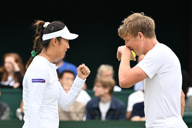 (250705) -- LONDON, July 5, 2025 (Xinhua) -- Chan Hao-Ching (L)/Andre Goransson react during the mixed doubles first round match between Zhang Shuai of China/Marcelo Arevalo of El Salvador and Chan Hao-Ching of Chinese Taipei/Andre Goransson of Sweden at the Wimbledon Tennis Championships in London, Britain, July 5, 2025. (Xinhua/Zhao Dingzhe)