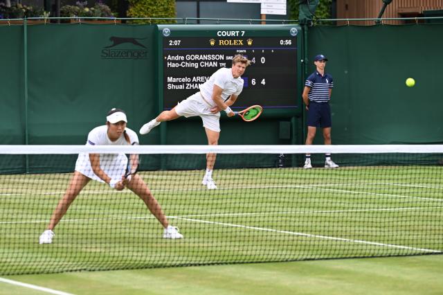 (250705) -- LONDON, July 5, 2025 (Xinhua) -- Chan Hao-Ching/Andre Goransson (R) compete during the mixed doubles first round match between Zhang Shuai of China/Marcelo Arevalo of El Salvador and Chan Hao-Ching of Chinese Taipei/Andre Goransson of Sweden at the Wimbledon Tennis Championships in London, Britain, July 5, 2025. (Xinhua/Zhao Dingzhe)
