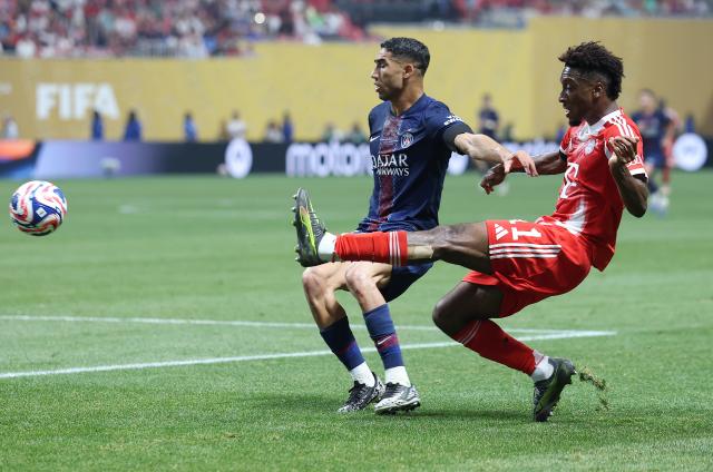 (250706) -- ATLANTA, July 6, 2025 (Xinhua) -- Kingsley Coman (R) of FC Bayern Munich passes the ball during the quarterfinal match between Paris Saint-Germain (FRA) and FC Bayern Munich (GER) at the FIFA Club World Cup 2025 at the Mercedes-Benz Stadium, Atlanta, Georgia, the United States, July 5, 2025. (Xinhua/Li Ming)