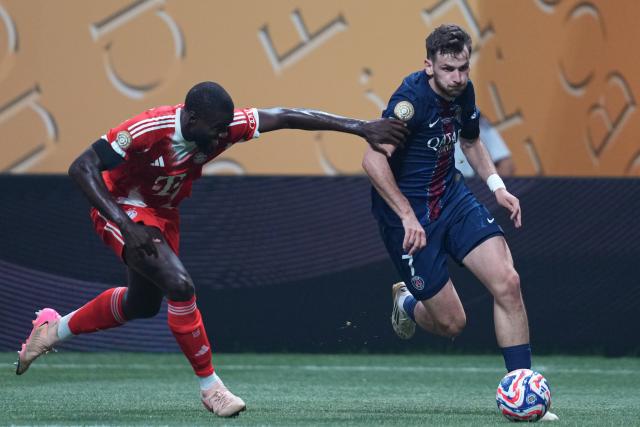 (250706) -- ATLANTA, July 6, 2025 (Xinhua) -- Khvicha Kvaratskhelia (R) of Paris Saint-Germain vies with Dayot Upamecano of FC Bayern Munich during the quarterfinal match between Paris Saint-Germain (FRA) and FC Bayern Munich (GER) at the FIFA Club World Cup 2025 at the Mercedes-Benz Stadium, Atlanta, Georgia, the United States, July 5, 2025. (Xinhua/Huang Zongzhi)