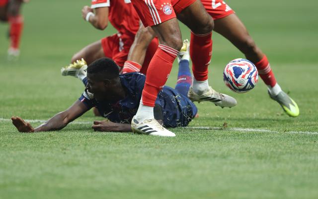 (250706) -- ATLANTA, July 6, 2025 (Xinhua) -- Nuno Mendes (down) of Paris Saint-Germain falls during the quarterfinal match between Paris Saint-Germain (FRA) and FC Bayern Munich (GER) at the FIFA Club World Cup 2025 at the Mercedes-Benz Stadium, Atlanta, Georgia, the United States, July 5, 2025. (Xinhua/Li Ming)