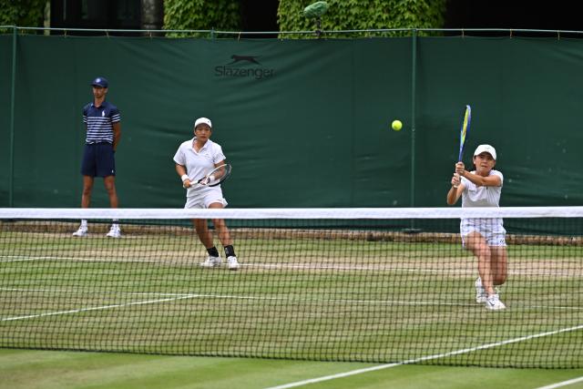 (250706) -- LONDON, July 6, 2025 (Xinhua) -- Jiang Xinyu (C)/Wu Fang-Hsien (R) compete during the women's doubles second round match between Jiang Xinyu of China/Wu Fang-Hsien Chinese Taipei and Olivia Gadecki of Australia/Desirae Krawczyk of the United States at the Wimbledon Tennis Championships in London, Britain, July 5, 2025. (Xinhua/Zhao Dingzhe)