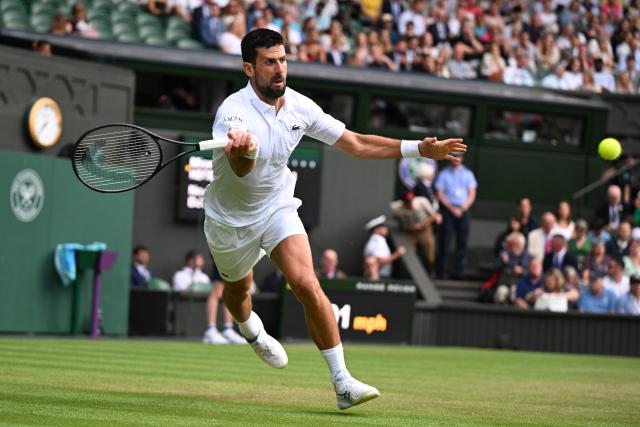 (250706) -- LONDON, July 6, 2025 (Xinhua) -- Novak Djokovic hits a return during the men's singles third round match between Novak Djokovic of Serbia and Miomir Kecmanovic of Serbia at the Wimbledon Tennis Championships in London, Britain, July 5, 2025. (Xinhua/Zhao Dingzhe)