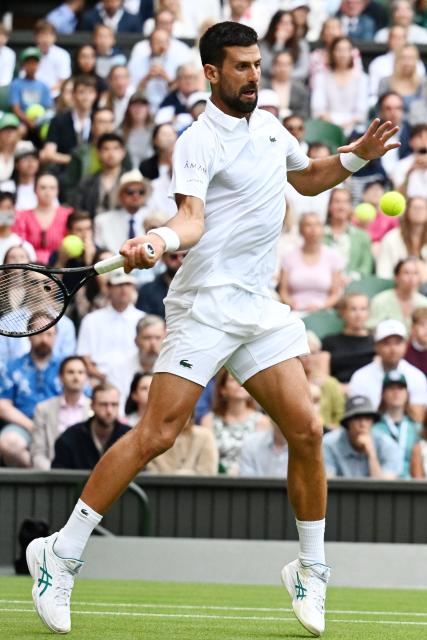 (250706) -- LONDON, July 6, 2025 (Xinhua) -- Novak Djokovic hits a return during the men's singles third round match between Novak Djokovic of Serbia and Miomir Kecmanovic of Serbia at the Wimbledon Tennis Championships in London, Britain, July 5, 2025. (Xinhua/Zhao Dingzhe)