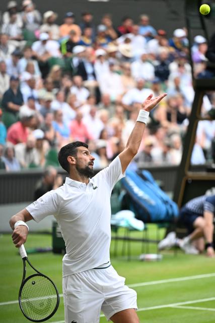 (250706) -- LONDON, July 6, 2025 (Xinhua) -- Novak Djokovic serves during the men's singles third round match between Novak Djokovic of Serbia and Miomir Kecmanovic of Serbia at the Wimbledon Tennis Championships in London, Britain, July 5, 2025. (Xinhua/Zhao Dingzhe)