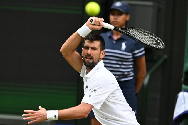 (250706) -- LONDON, July 6, 2025 (Xinhua) -- Novak Djokovic hits a return during the men's singles third round match between Novak Djokovic of Serbia and Miomir Kecmanovic of Serbia at the Wimbledon Tennis Championships in London, Britain, July 5, 2025. (Xinhua/Zhao Dingzhe)