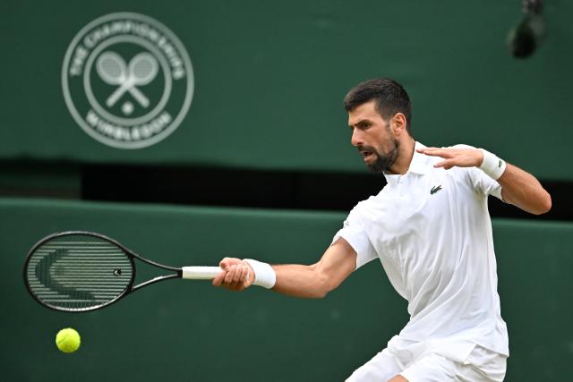 (250706) -- LONDON, July 6, 2025 (Xinhua) -- Novak Djokovic hits a return during the men's singles third round match between Novak Djokovic of Serbia and Miomir Kecmanovic of Serbia at the Wimbledon Tennis Championships in London, Britain, July 5, 2025. (Xinhua/Zhao Dingzhe)