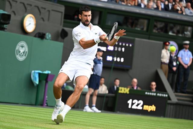 (250706) -- LONDON, July 6, 2025 (Xinhua) -- Novak Djokovic hits a return during the men's singles third round match between Novak Djokovic of Serbia and Miomir Kecmanovic of Serbia at the Wimbledon Tennis Championships in London, Britain, July 5, 2025. (Xinhua/Zhao Dingzhe)
