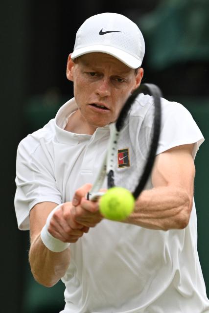 (250706) -- LONDON, July 6, 2025 (Xinhua) -- Jannik Sinner hits a return during the men's singles third round match between Jannik Sinner of Italy and Pedro Martinez of Spain at the Wimbledon Tennis Championships in London, Britain, July 5, 2025. (Xinhua/Zhao Dingzhe)