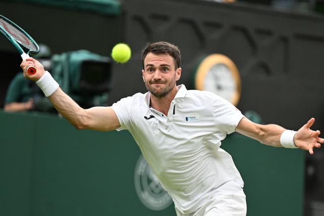(250706) -- LONDON, July 6, 2025 (Xinhua) -- Pedro Martinez hits a return during the men's singles third round match between Jannik Sinner of Italy and Pedro Martinez of Spain at the Wimbledon Tennis Championships in London, Britain, July 5, 2025. (Xinhua/Zhao Dingzhe)