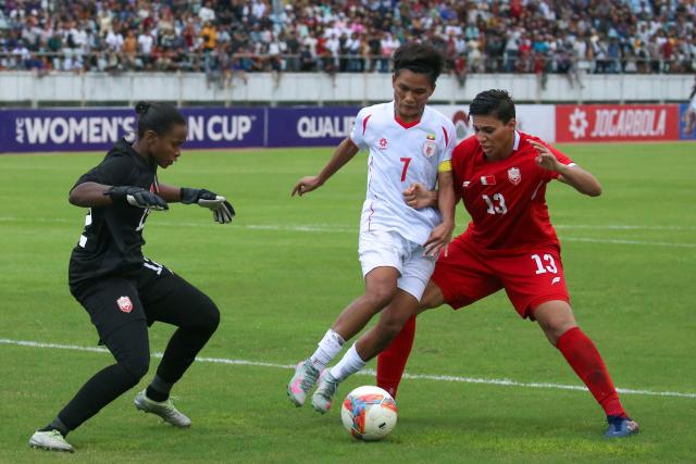 (250706) -- YANGON, July 6, 2025 (Xinhua) -- Win Theingi Tun (C) of Myanmar vies for the ball during the AFC Women's Asian Cup 2026 qualifiers Group C football match between Myanmar and Bahrain in Yangon, Myanmar, July 5, 2025. (Xinhua/Myo Kyaw Soe)