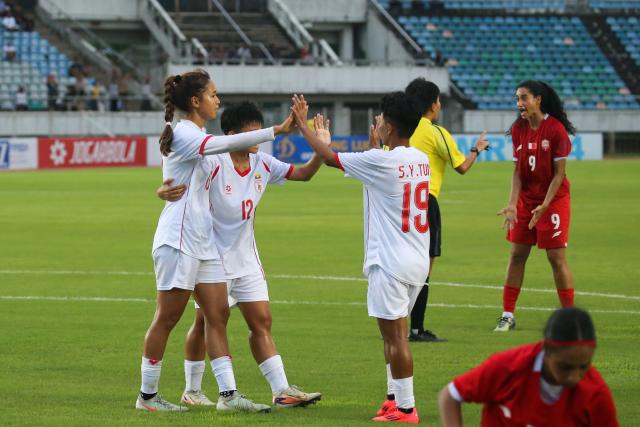(250706) -- YANGON, July 6, 2025 (Xinhua) -- Players of Myanmar celebrate scoring during the AFC Women's Asian Cup 2026 qualifiers Group C football match between Myanmar and Bahrain in Yangon, Myanmar, July 5, 2025. (Xinhua/Myo Kyaw Soe)