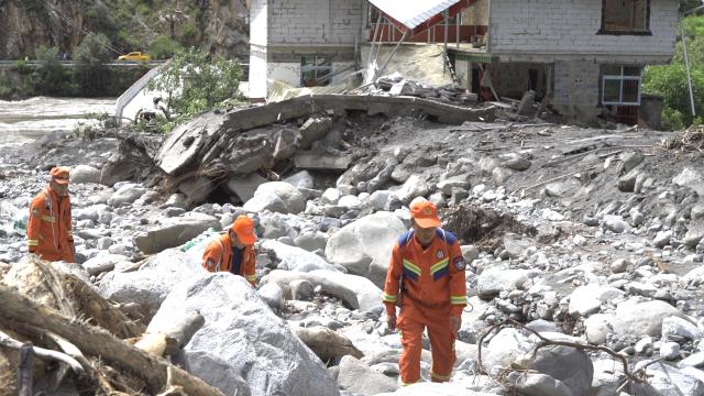 (250706) -- CHENGDU, July 6, 2025 (Xinhua) -- Rescuers search for survivors at a site of mudslide in Rongchag County, Garze Tibetan Autonomous Prefecture, southwest China's Sichuan Province, July 5, 2025.
  Four people were missing following a mudslide on Friday in southwest China's Sichuan Province, authorities said on Saturday.
  The mudslide hit two villages in Rongchag County at around 5:50 p.m. on Friday, after the entire county was drenched by a continuous rainstorm since Wednesday, according to the geological disaster prevention and control headquarters of the county.
  The mudslide, combined with a mountain torrent, damaged houses, inundated farmland and cut telecommunications, power and access to certain roads.
  After the disaster, the county immediately activated emergency responses for geological disasters and flood control.
  Rescuers are still searching for the missing people.
  Since Wednesday, rain-triggered mudslides have affected 12 townships in the county -- forcing 1,719 residents to evacuate. (Xinhua)