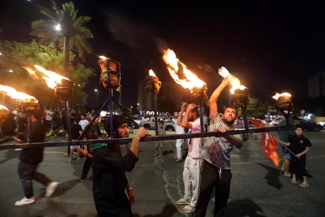 (250706) -- BAGHDAD, July 6, 2025 (Xinhua) -- People participate in commemorative activity on the occasion of Ashura, in Baghdad, Iraq, on July 5, 2025. Ashura takes place on the 10th day of Muharram, the first month in the Islamic lunar calendar. (Xinhua/Khalil Dawood)