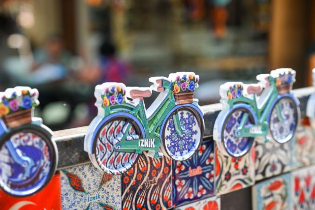 (250706) -- IZNIK, July 6, 2025 (Xinhua) -- This photo taken on June 26, 2025 shows porcelain-inspired cultural and creative products in a porcelain shop in Iznik,Türkiye. Walking through the streets of Iznik, Türkiye, one finds ceramic elements everywhere. The clock tower in the city center is adorned with tile murals depicting sailing ships. House numbers on ordinary homes are carefully inscribed on elegant ceramic tiles. Family-run porcelain workshops and ceramic stalls line the streets.
  Iznik is known as Türkiye's "porcelain capital." From the 15th to the 17th century, the city flourished as a center for producing blue-and-white porcelain but gradually declined in the following centuries.
  In recent years, however, Iznik has been committed to reviving its ceramic heritage and rejuvenating its reputation as Türkiye's "porcelain capital." As part of this effort, Iznik has strengthened exchanges with Jingdezhen, often dubbed China's "porcelain capital."
  In 2021, the two porcelain capitals became sister cities, and the Iznik municipal government organized multiple visits to Jingdezhen for study and exchange.
   In 2025, Jingdezhen's second official overseas flagship store opened in Türkiye, and the two cities also signed a ceramic industry alliance cooperation agreement. Today, Iznik and Jingdezhen are deepening their ties through ceramics, adding a new layer to the modern story of the Silk Road. (Xinhua/Liu Lei)