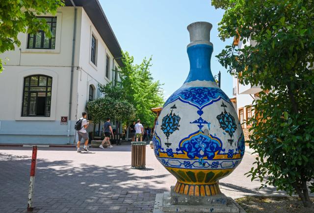 (250706) -- IZNIK, July 6, 2025 (Xinhua) -- This photo taken on June 16, 2025 shows an entrance to the Porcelain Market in Iznik, Türkiye. Walking through the streets of Iznik, Türkiye, one finds ceramic elements everywhere. The clock tower in the city center is adorned with tile murals depicting sailing ships. House numbers on ordinary homes are carefully inscribed on elegant ceramic tiles. Family-run porcelain workshops and ceramic stalls line the streets.
  Iznik is known as Türkiye's "porcelain capital." From the 15th to the 17th century, the city flourished as a center for producing blue-and-white porcelain but gradually declined in the following centuries.
  In recent years, however, Iznik has been committed to reviving its ceramic heritage and rejuvenating its reputation as Türkiye's "porcelain capital." As part of this effort, Iznik has strengthened exchanges with Jingdezhen, often dubbed China's "porcelain capital."
  In 2021, the two porcelain capitals became sister cities, and the Iznik municipal government organized multiple visits to Jingdezhen for study and exchange.
   In 2025, Jingdezhen's second official overseas flagship store opened in Türkiye, and the two cities also signed a ceramic industry alliance cooperation agreement. Today, Iznik and Jingdezhen are deepening their ties through ceramics, adding a new layer to the modern story of the Silk Road. (Xinhua/Liu Lei)
