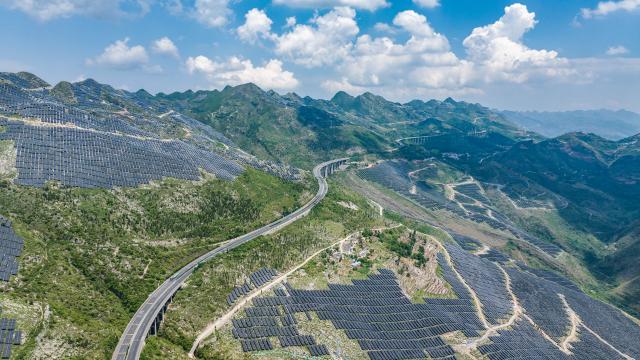 (250706) -- GUIYANG, July 6, 2025 (Xinhua) -- An aerial drone photo taken on May 23, 2024 shows the Panjiang million-kilowatt photovoltaic base project in the Bouyei-Miao Autonomous County of Guanling, southwest China's Guizhou Province. In recent years, Guizhou has made significant progress in ecological construction, striving to transform ecological advantages into developmental strengths. 
  While actively developing green energy sources such as wind and solar power, Guizhou makes full use of the land beneath photovoltaic panels to cultivate crops, and meanwhile encourages farmers to engage in agricultural planting by leveraging diverse terrain and varied climate, an effort to enhance farmers' income.
  Currently, Guizhou's forest coverage rate stands at 63.3 percent, and its green economy accounts for 48 percent of the province's overall economic composition. (Xinhua/Tao Liang)