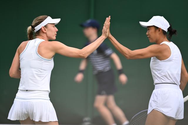 (250707) -- LONDON, July 7, 2025 (Xinhua) -- Zhang Shuai (R)/Ekaterina Alexandrova react during the women's doubles third round match between Zhang Shuai (China)/Ekaterina Alexandrova (Russia) and Hsieh Su-Wei (Chinese Taipei)/Jelena Ostapenko (Latvia) at the Wimbledon Tennis Championships in London, Britain, July 6, 2025. (Xinhua/Zhao Dingzhe)