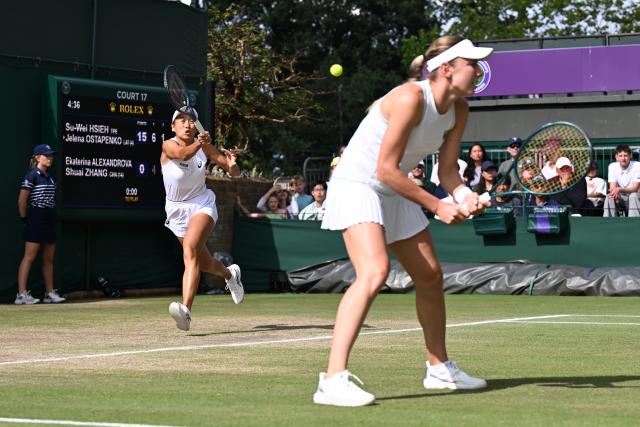 (250707) -- LONDON, July 7, 2025 (Xinhua) -- Zhang Shuai (L)/Ekaterina Alexandrova compete during the women's doubles third round match between Zhang Shuai (China)/Ekaterina Alexandrova (Russia) and Hsieh Su-Wei (Chinese Taipei)/Jelena Ostapenko (Latvia) at the Wimbledon Tennis Championships in London, Britain, July 6, 2025. (Xinhua/Zhao Dingzhe)
